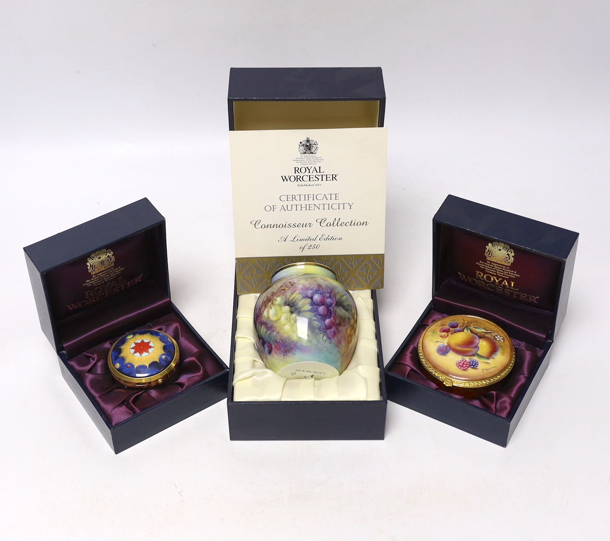 A modern boxed limited edition Moorcroft enamel vase, together with two Royal Worcester boxed porcelain boxes (3)